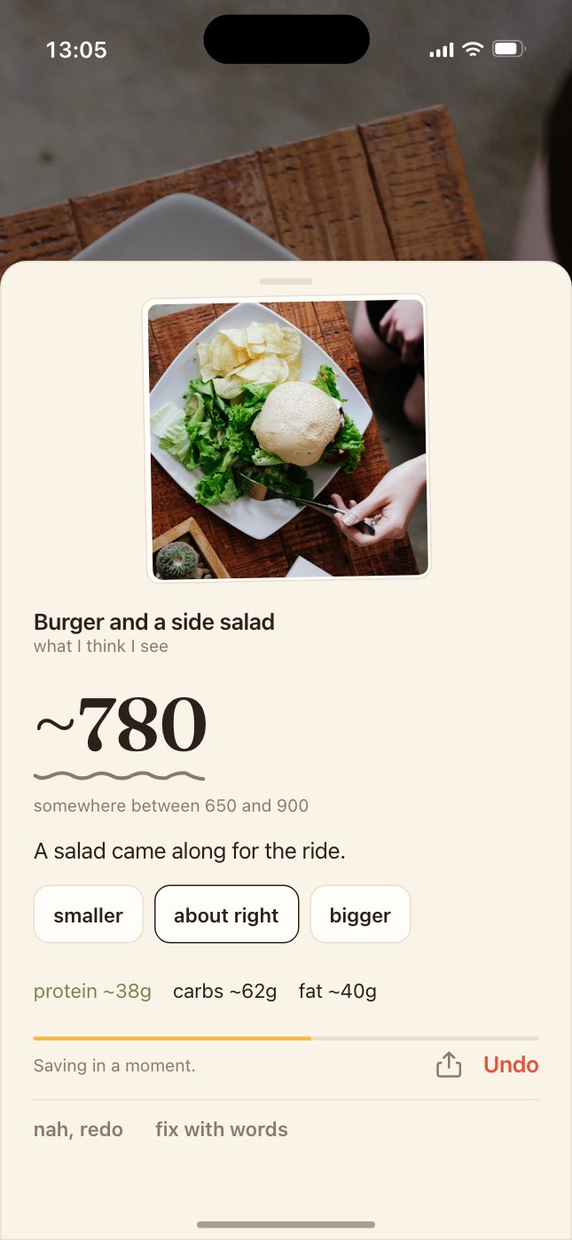 Nomzo's estimate card for a burger and a side salad: ~780 with a hand-drawn squiggle under it, somewhere between 650 and 900, and chips for a smaller or bigger portion.